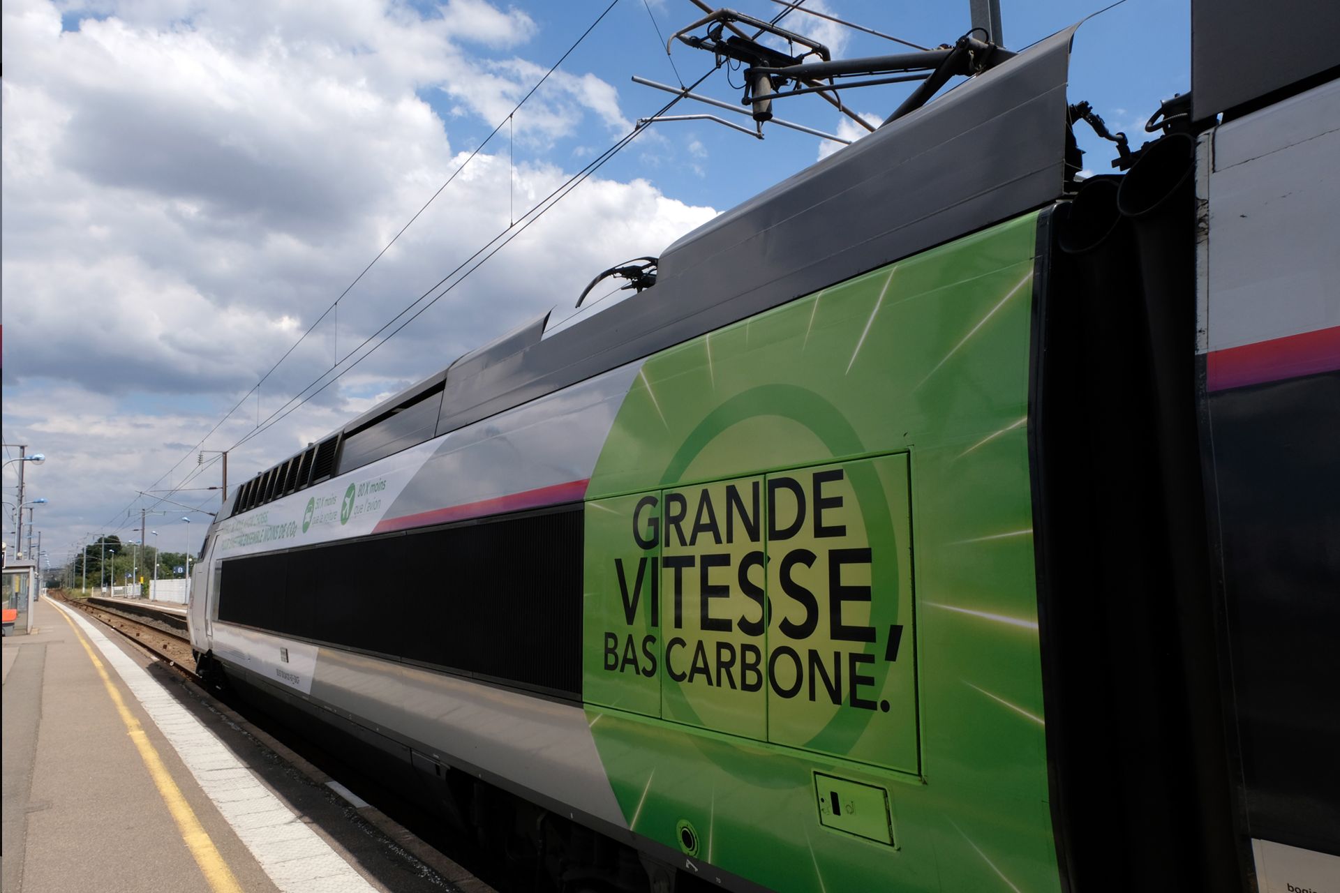 TGV in Vannes railway station in Brittany with low carbon high speed written in French on the locomotive © Richard Villalon